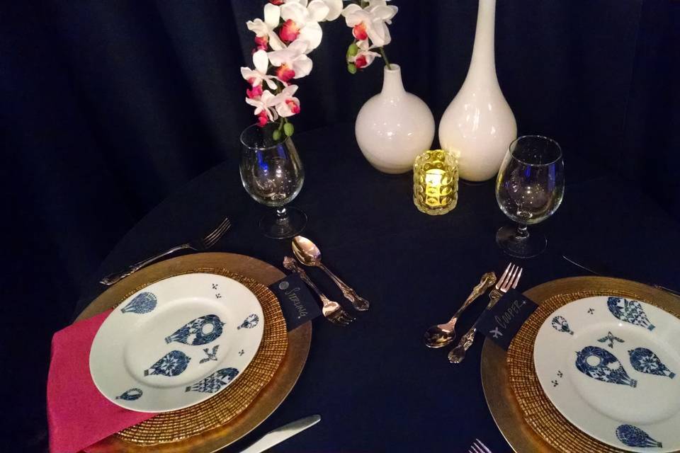 Spring 2015 wedding show. Pan Am inspired travel themed tablescape. Navy was the background for magenta and gold accents.
Styling: AWE Productions.