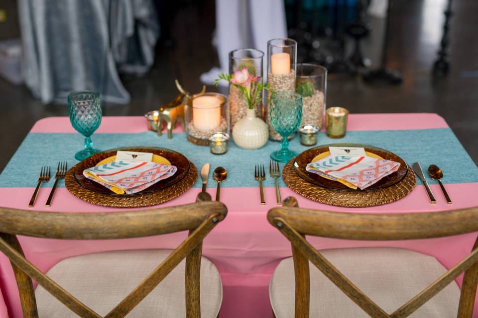 Casual, southwest inspired sweetheart table complete with cacti and a gold bull.
Photo by Aralani Photography
Styling: AWE Productions