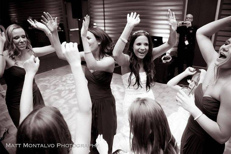 The bride with her bridesmaids dancing