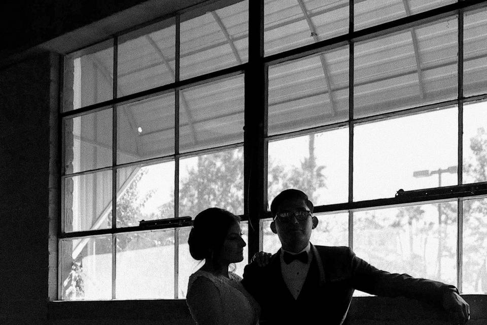 Couple standing by window