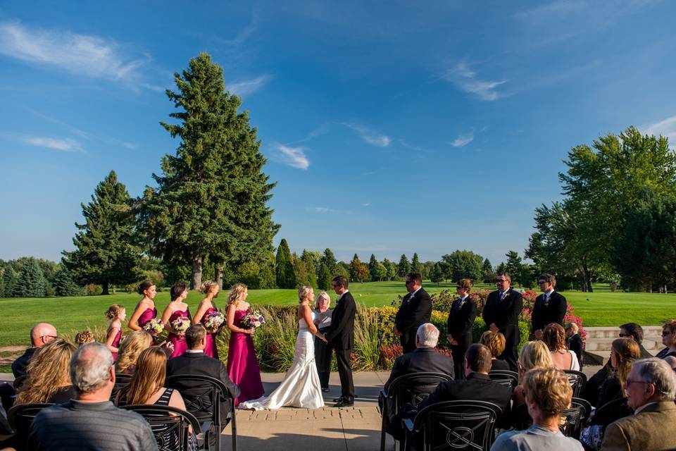 Outdoor wedding ceremony golf course backdrop