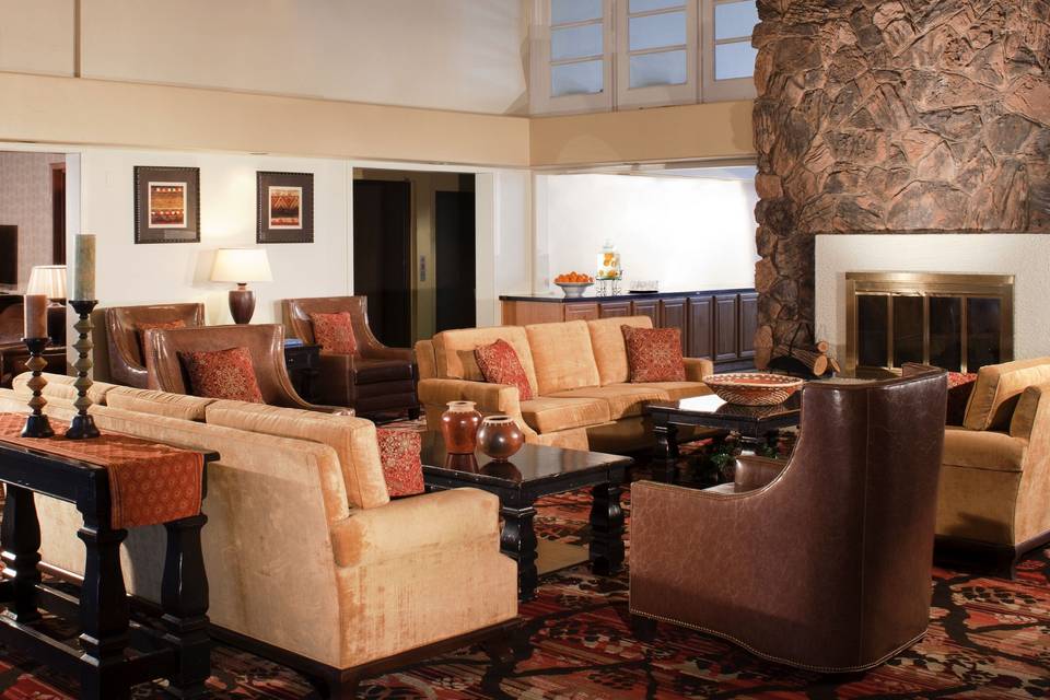 Our Lobby featuring our Flagstaff Fireplace.