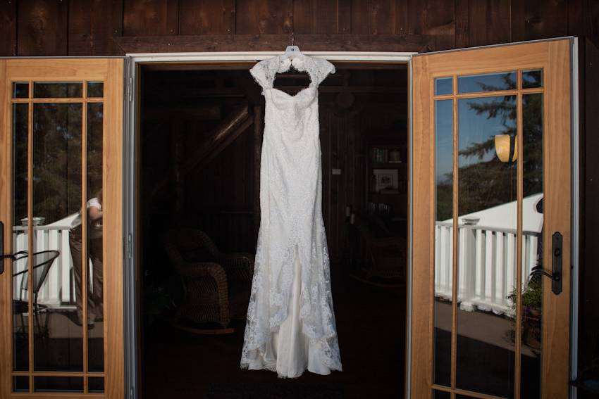 Wedding dress hanging in door