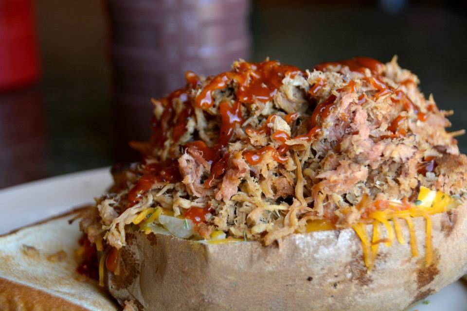 Our famous Barbecue Stuffed Potatoes can be in Chicken, Beef, or Pork (pictured here) - with all the toppings these are the perfect wedding station for a crowd-pleasing selection of foods!