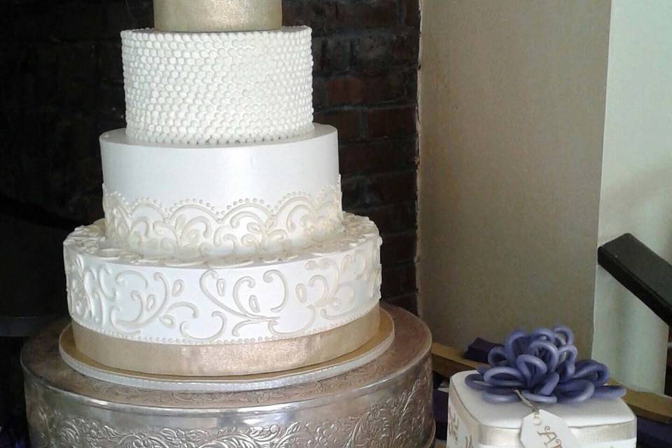 simple, classic, elegant buttercream wedding cake with edible gold accents and coordinating grooms cake
