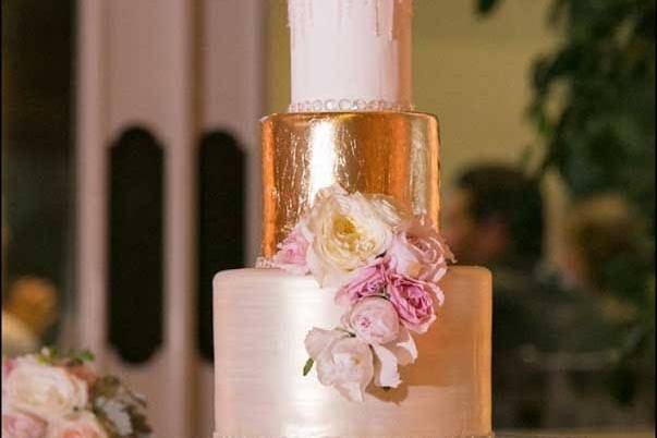 Aracelli's shimmery blush and edible gold leaf wedding cake with sugar crystal bling and fresh flowers