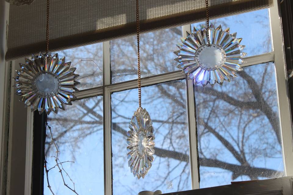 Three SunRain Hanging in Windo