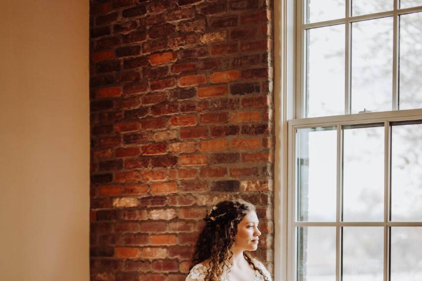 Bride looking out window