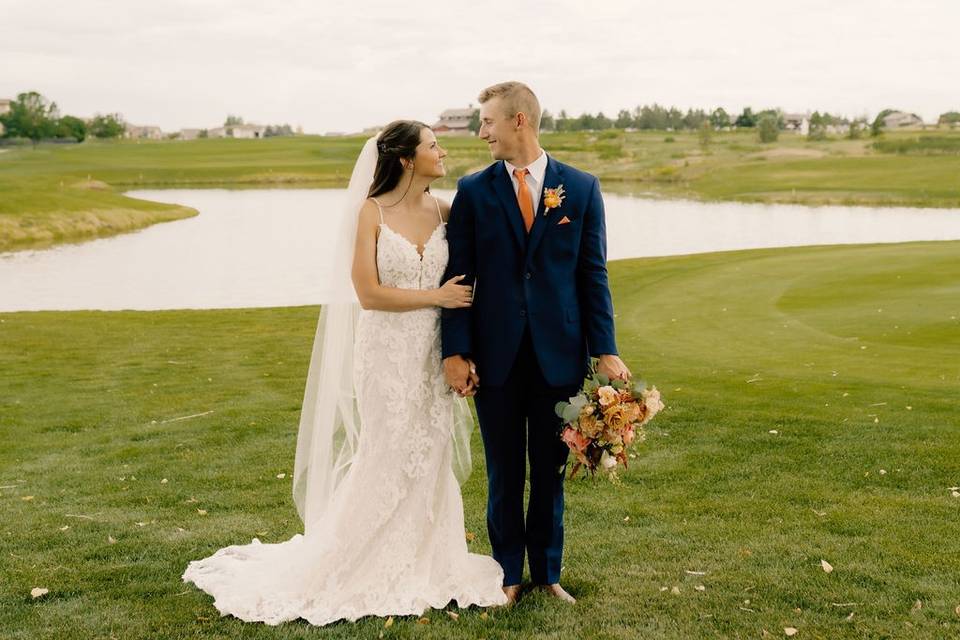 Couple walking on golf course