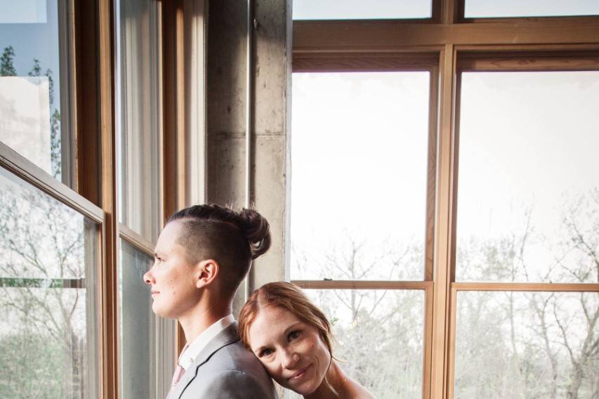 Couple standing by window