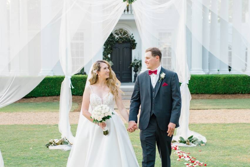 Couple walking down aisle