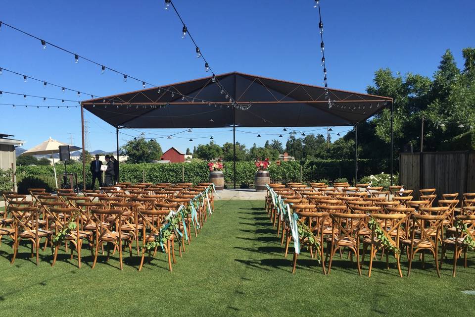 Wedding ceremony area in front of vineyards