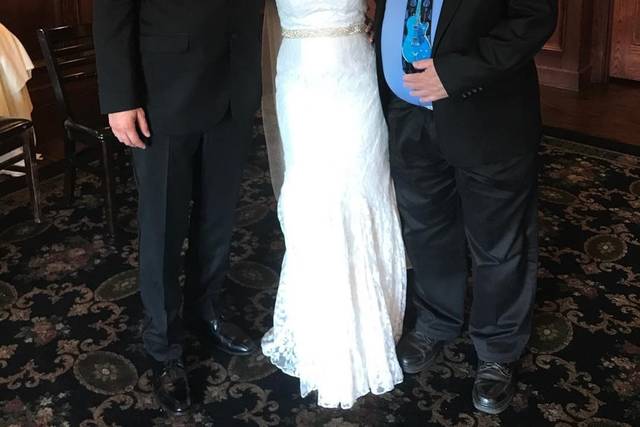 Couple with wedding officiant