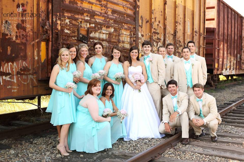 The couple with the bridesmaids and groomsmen