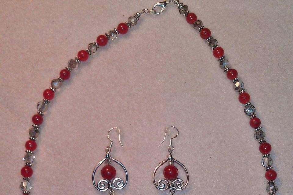 This is made with Red Jade and Silver Shade Swarvoski Crystals, Tibetan Silver, is Lead & Nickle Free. Lobster Clasp is Silver Plated & Earring Wires are Sterling Silver These are Custom Made as are all my creations.
You tell me what you are looking for and I will create it.
This is a One of Kind piece and These Bride Maids and Maid of Honor are the only ones who will have these Sets.
I Will create for the Bride, and her whole wedding party.
I have reasonable rates. This set went for $60 a piece.
Please feel free to contact me at: 910-409-2492 or email:
magicalcreationsbymicheline@gmail.com