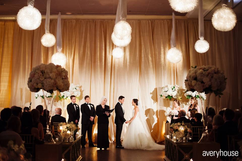 Indoor ceremony with drapery and hanging lightsPhoto Credit: Avery Househttp://galleries.averyhouse.net