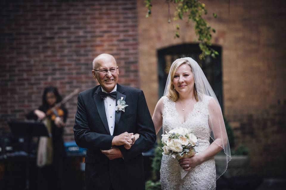 Bride walking down aisle with father - ceremony in Ivy Room CourtyardPhoto Credit Erin Hoyt Photographyhttp://erinhoytphotography.com/