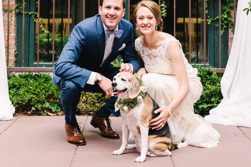 Couple in courtyard with their dogPhoto Credit: T&S Hughes Photographyhttp://tandshughesphotography.com/