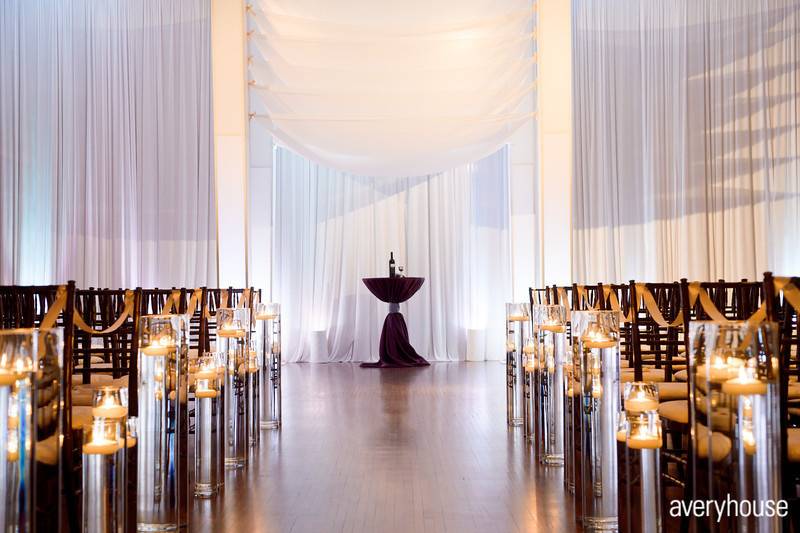 Indoor ceremony decor with draperyPhoto Credit: Avery Househttp://galleries.averyhouse.net