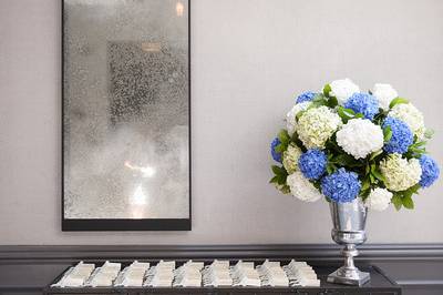 Credenza with Escort Cards and Florals in Ivy Room FoyerPhoto Credit: Avery Househttp://galleries.averyhouse.net