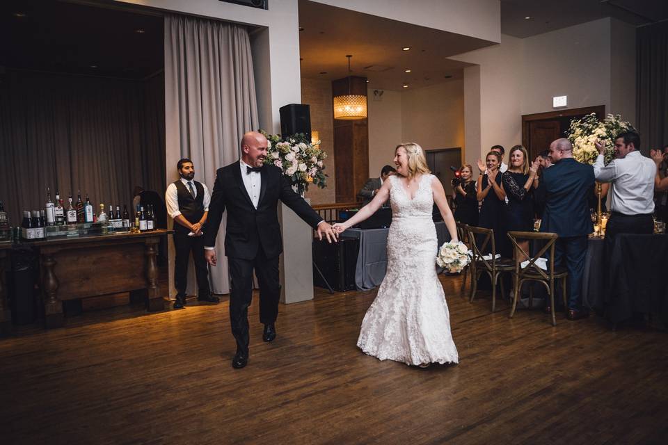 Bride and groom being introduced at receptionPhoto Credit Erin Hoyt Photographyhttp://erinhoytphotography.com/