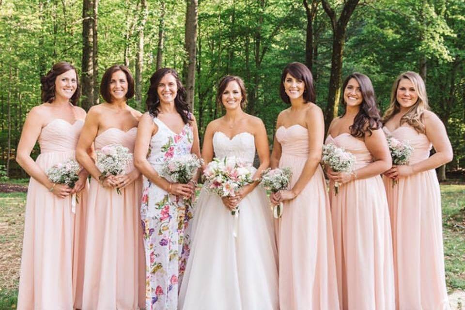 Bride accompanied by bridesmaids