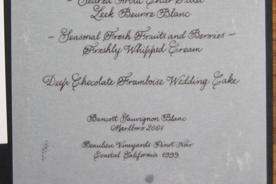 Copperplate menu with custom monogram on vellum