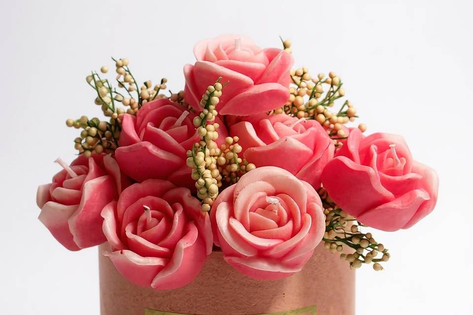 Rose candles in pink vase