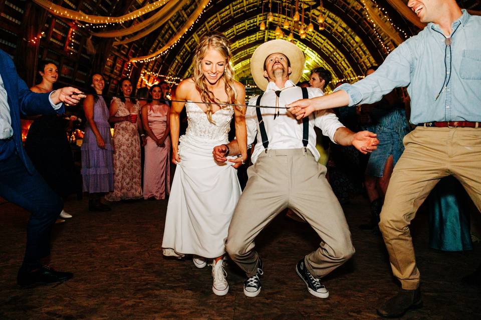 Bride & groom doing limbo