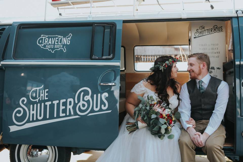 Newlyweds in the photo booth bus