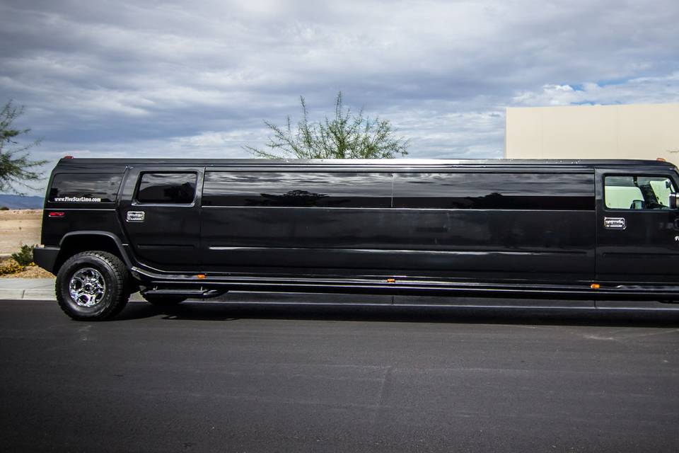 Black stretch hummer limo side view