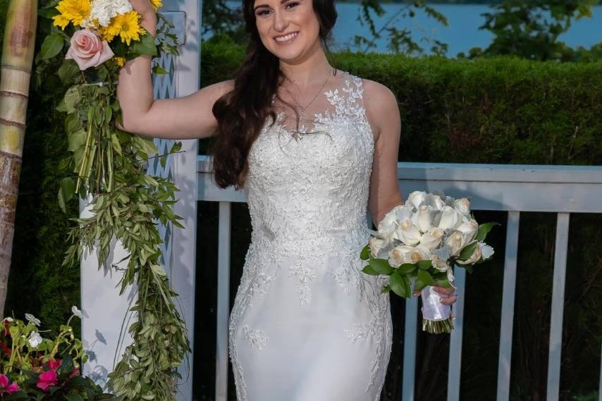 Bride posing with flowers