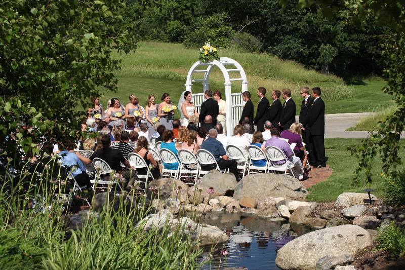 Outdoor wedding ceremony overlooking the golf course