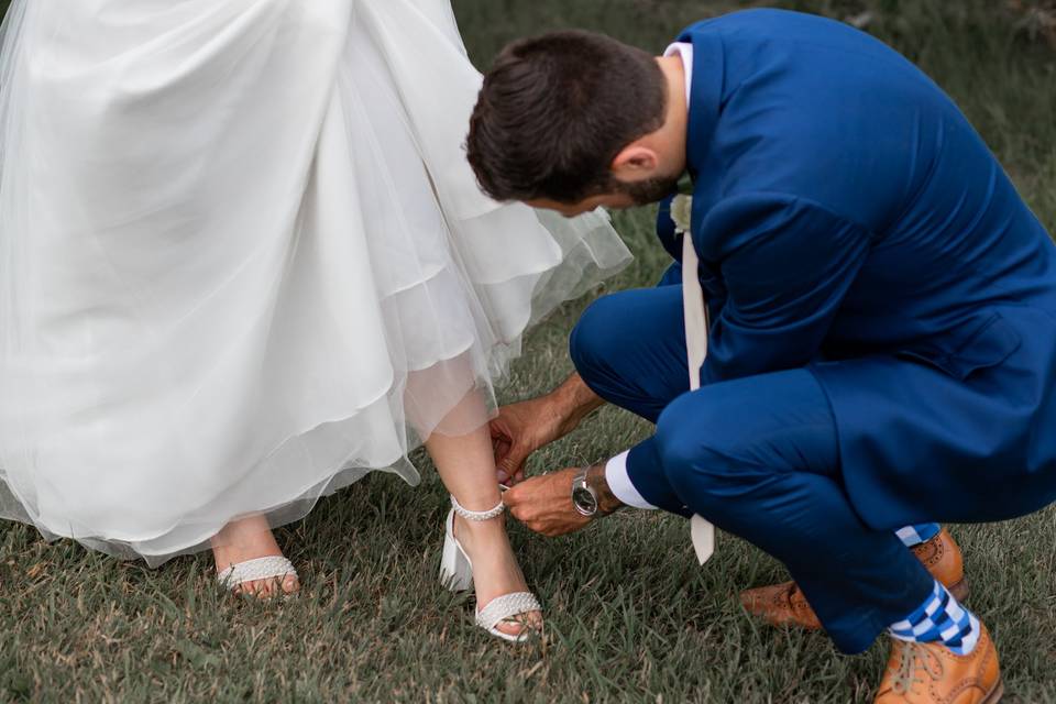 Groom helps bride