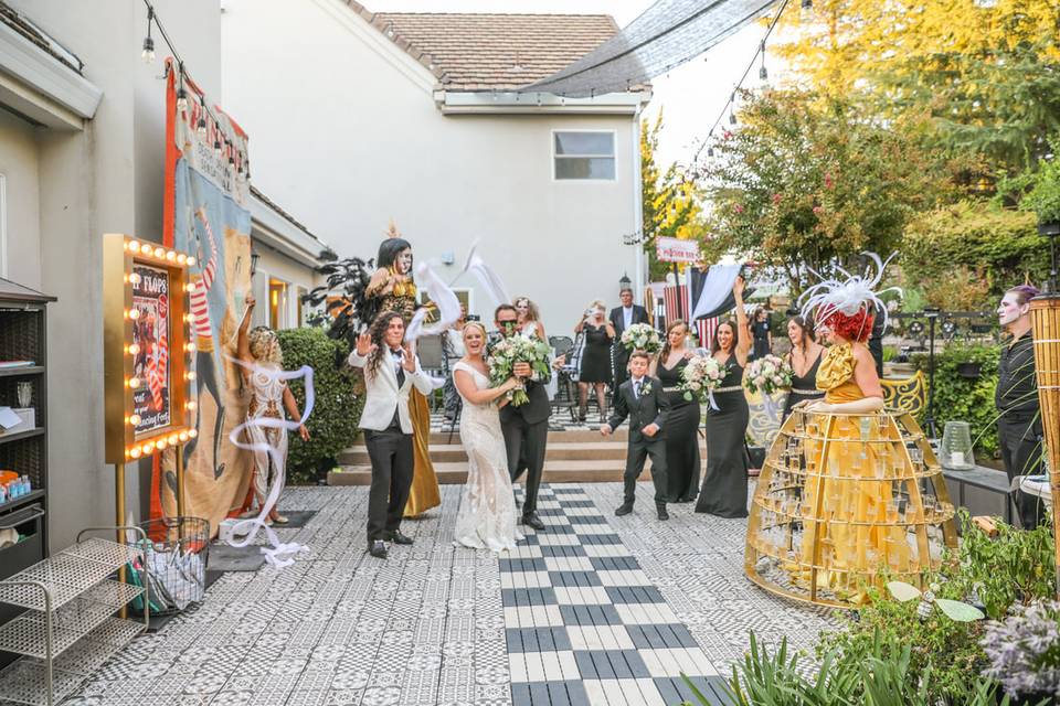 Stilt walkers, champagne skirt