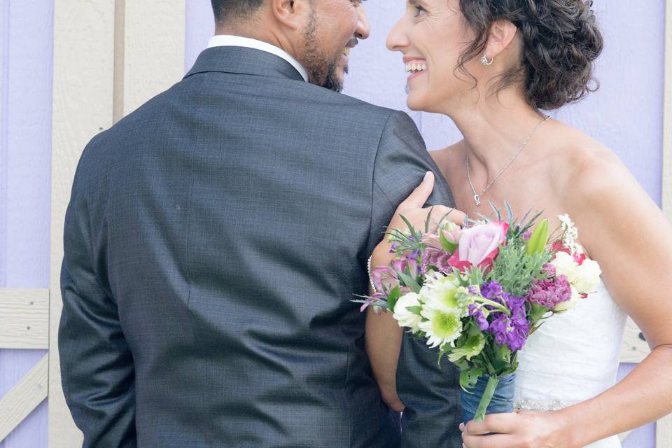 Couple embracing with bouquet