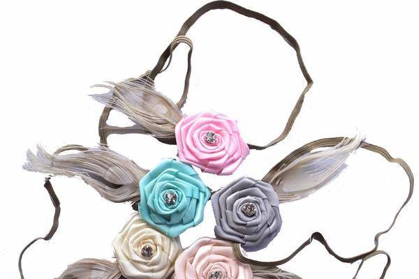 Feather flower florettes by Headbands of Hope. Perfect for your flower girl! For each headband sold, one is donated to a child with cancer.