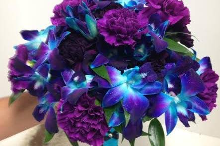 Blue and purple orchids with purple carnations