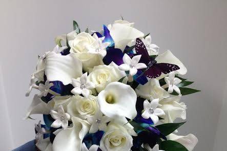 Cascade bouquet of white calla lilys white roses