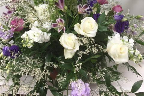 Fern and white rose arrangement