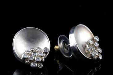 Designer Silver Bowl of Diamonds Earringshttp://www.orospot.com/product/e1004jg/designer-silver-bowl-of-diamonds-earrings.aspxSKU: E1004JG $1,200.00Designer silver bowl of overflowing diamonds - abundance earrings, are 19mm tall and 16 mm wide (5/8 x 3/4 inch). This elegant matte finish earrings contains burnish set round cut diamonds ( .54cttw , G-H color and VS1-VS2 clarity).