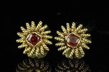 Vintage Style Garnet Earrings 14K Yellow Goldhttp://www.orospot.com/product/e271ma/vintage-style-garnet-earrings-14k-yellow-gold.aspxSKU: E271MA$339.00Ornate antique reproduction earring with a round garnet (approx 2cttw both) and pierced wires, with twisted wire rosette design. Earrings are 13 mm in diameter (5/10 inch) and are made of 14k yellow gold. This Style is also available in white gold and variety of different gems to pick from. We offer Citrine, Blue Topaz, Garnet and Peridot, so you can pick stone you love the most.