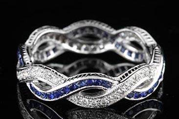 Vintage Infinity Style 18K White Gold Diamond Sapphire Eternity Band Ringhttp://www.orospot.com/product/b546239mh/vintage-infinity-style-18k-white-gold-diamond-sapphire-eternity-band-ring.aspxSKU: B546239MH $1,849.00Infinity, eternity design band is made of 18K white gold and contains round cut diamonds (.40Cttw, G-VS quality) pave set and sapphire (.60Cttw) channel set. Wedding ring is engraved on the sides and top is millegrained. All finger sizes are available, please contact us for your size preference. Please allow 2- 3 weeks to complete this order.