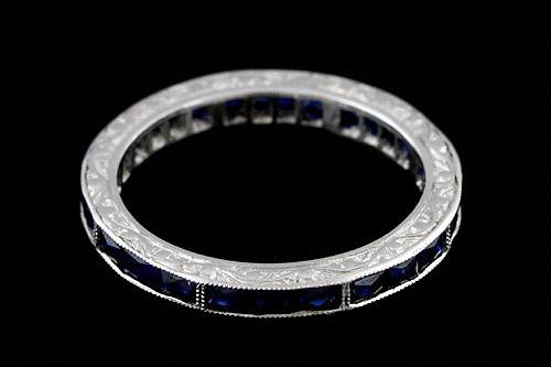 Platinum Art Deco Style French Cut Baguette Blue Sapphires Engraved Eternity Wedding Bandhttp://www.orospot.com/product/b50020mh/platinum-art-deco-style-french-cut-baguette-blue-sapphires-engraved-eternity-wedding-band.aspxSKU: B50020MH $1,719.00This vintage style engraved eternity blue sapphire wedding band is a 950 platinum piece. The height of this band is 2.3mm and the width is 2.35mm. This art deco style wedding band contains 1.44CT natural french cut baguette blue sapphires channel set all around the shank. The edges are milgrained and sides are beautifully engraved and high polished. Approximate Band Weight: 3.1 grams (ring size 6) This wedding band is available in all sizes, please contact us for your size preference. Please allow 2-3 weeks to complete the order.