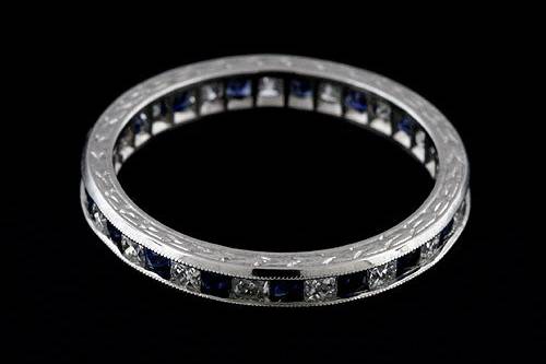 Channel Set 1.3cttw French Cut Princess Shape Sapphires and Diamonds Eternity Wedding Bandhttp://www.orospot.com/product/b56327mh/channel-set-1-3cttw-french-cut-princess-shape-sapphires-and-diamonds-eternity-wedding-band.aspxSKU: B56327MH $3,199.00This Art Deco style eternity wedding band is a 950 platinum piece. The height of this band is 1.8mm and the width is 2.85mm. This wedding band contains 0.70CT french cut princess shape natural blue sapphires and 0.60CT french cut princess shape natural diamonds channel set all around the shank. The edges are milgrained and both sides are beautifully engraved. Approximate Band Weight: 2.7 grams (ring size 6.25) This wedding band is available in all sizes, please contact us for your size preference. Please allow 2-3 weeks to complete the order.