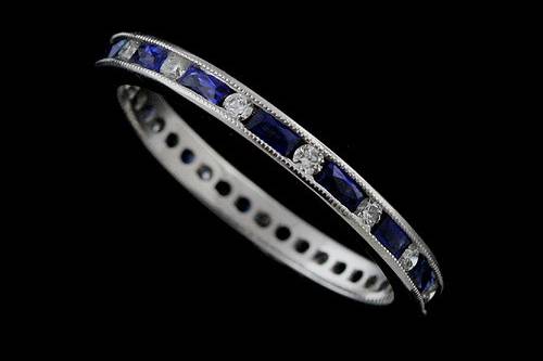 Classic Channel Set 0.73cttw French Cut Baguette Sapphires and Round Diamonds Eternity Wedding Bandhttp://www.orospot.com/product/b544214mh/classic-channel-set-0-73cttw-french-cut-baguette-sapphires-and-round-diamonds-eternity-wedding-band.aspxSKU: B544214MH $1,699.00This beautiful classic style eternity wedding band is a 950 platinum piece. The height of this band is 1.65mm and the width is 2.2mm. This wedding band contains 0.60CT french cut baguette natural blue sapphires and 0.13CT round shape natural diamonds channel set all around the shank. The edges are milgrained and sides are high polished. Approximate Band Weight: 2.1 grams (ring size 4.75) This wedding band is available in all sizes, please contact us for your size preference. Please allow 2-3 weeks to complete the order.