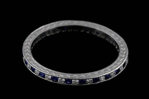 Platinum 950 Art Deco Style 0.35cttw Blue Sapphires and Diamonds Eternity Wedding Bandhttp://www.orospot.com/product/b5351023mh/platinum-950-art-deco-style-0-35cttw-blue-sapphires-and-diamonds-eternity-wedding-band.aspxSKU: B5351023MH$1,149.00This beautiful 950 platinum eternity wedding band contains high polish finish. The height of this band is 1.9mm and the width is 1.9mm. This vintage style wedding band contains 0.18CT round shape natural blue sapphires and 0.17CT round shape natural diamonds channel set around the shank. Also, this band is milgrained on the edges and it is beautifully engraved on both sides. Approximate Band Weight: 2.1 grams (ring size 6.25) This wedding band is available in all sizes, please contact us for your size preference. Please allow 2-3 weeks to complete the order.