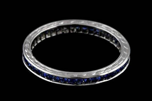 950 Platinum Vintage Art Deco Style 0.40CT Blue Sapphire Eternity Wedding Bandhttp://www.orospot.com/product/b5403840mh/950-platinum-vintage-art-deco-style-0-40ct-blue-sapphire-eternity-wedding-band.aspxSKU: B5403840MH $1,099.00This beautiful 950 platinum art deco style eternity wedding band contains high polish finish. The height of this band is 1.75mm and the width is 2.5mm. This vintage style engraved wedding band contains 0.40CT round shape natural blue sapphires channel set around the shank. Also, this band is milgrained on the edges and it is beautifully engraved on both sides. Approximate Band Weight: 2.1 grams (ring size 5) This wedding band is available in all sizes, please contact us for your size preference. Please allow 2-3 weeks to complete the order.