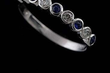 Bezel Set Diamond Sapphire Half Way 14k White Gold Wedding 2.8 mm Widehttp://www.orospot.com/product/b2027wpp/bezel-set-diamond-sapphire-half-way-14k-white-gold-wedding-2-8-mm-wide.aspxSKU: B2027WPP $349.00This modern style 14k white gold band contains an alternating pattern of white, brilliant cut, round diamonds G-SI1 quality, .10cttw and blue, round sapphires .13cttw. Half way band is 2.8 mm wide and 2.4 mm tall at the top, Height on the bottom shank is 1.3 mm, width 2 mm. Modern elegant ring is available in all sizes, please contact us for your size preference. Please allow 10 business to complete the order.
