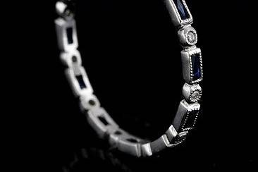 Final Sale 30% Off Platinum Art Deco Style Diamond and Blue Sapphire Stackable Eternity Ring Bandhttp://www.orospot.com/product/b780s117mhsale/final-sale-30-off-platinum-art-deco-style-diamond-and-blue-sapphire-stackable-eternity-ring-band.aspxSKU: B780S117MHSALE $909.00This beautiful stackable mini platinum band is only 1.7 mm wide and 1.5 mm tall. This Art Deco replica band contains 12 French cut blue sapphires baguettes (.30Cttw) set in channel and 12 tiny round bead set round brilliant diamonds (G-VS quality). Sides are high polish and top milgraied, band is available in size 7.75